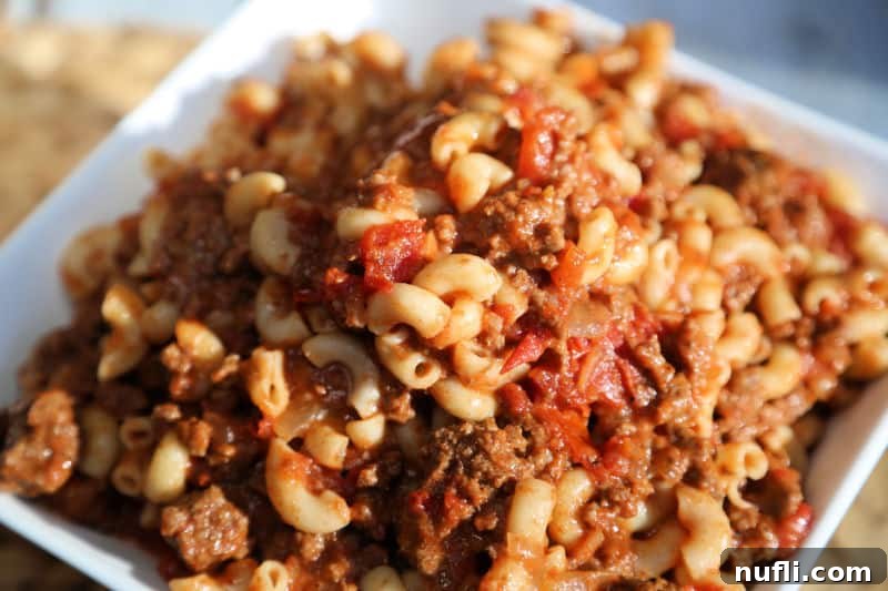 chili mac and cheese in a white bowl