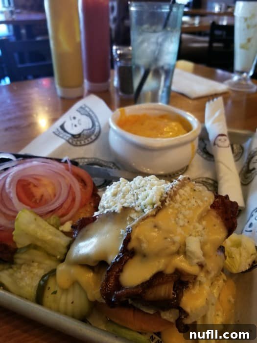 Walla Walla Dining Gems 8 burger on a platter next to water and condiments