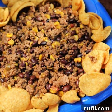 Lazy Day Frito Chili Bowl 3 Mexican chili surrounded by fritos on a blue plate