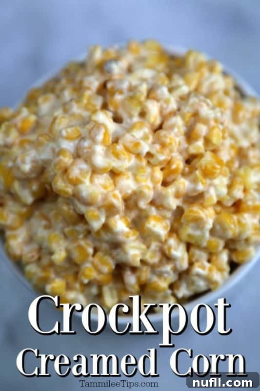 Creamy Crockpot Creamed Corn in a white bowl, ready to be served. The rich texture suggests a delightful comfort food.