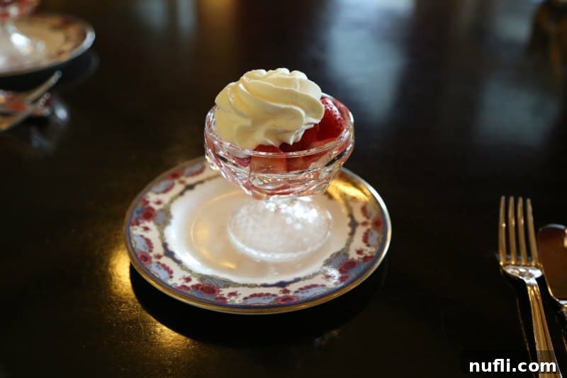 Delicate strawberries served with rich Empress cream on an ornate tea dish, a perfect start to the tea service.