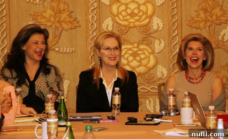 Meryl Streep, Christine Baranski and Tracey Ullman sharing a laugh at an interview table