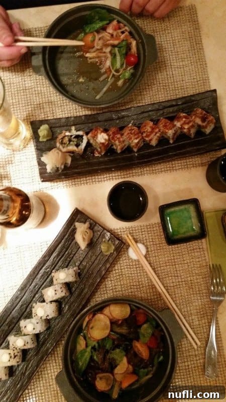 Bonsai Sushi table with plates of sushi and soup