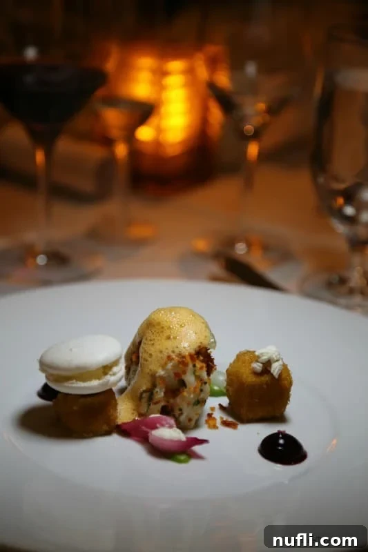 An artfully presented gourmet dessert featuring vibrant macarons and intricate edible garnishes.