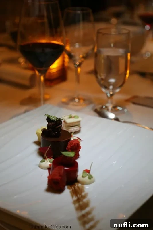 Carnival Sunshine's Exclusive Chef's Table 12 A sophisticated gourmet chocolate dessert, featuring intricate layers and textures on a pristine white plate
