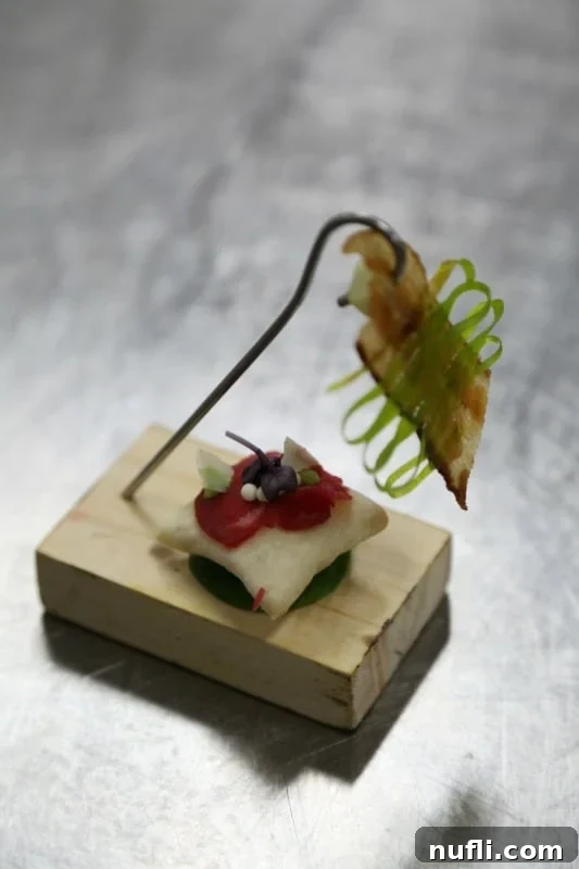 Carnival Sunshine's Exclusive Chef's Table 4 Exquisite Beef Carpaccio served delicately on an air pillow, promising a light yet rich flavor