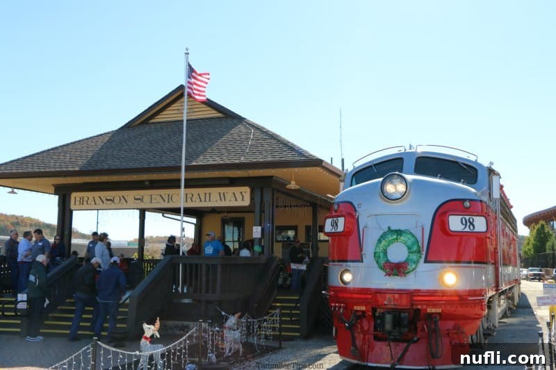 The Branson Scenic Railway engine awaits passengers at the historic Main Street station. Branson Scenic Railway engine parked outside the box office building