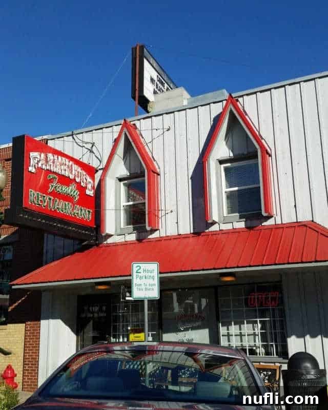 farmhouse restaurant entrance with red awning and sign 