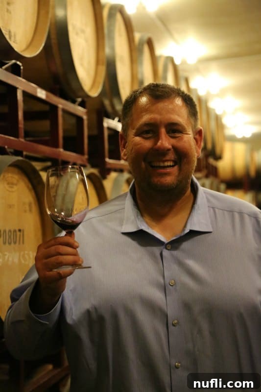 John holding a glass of wine