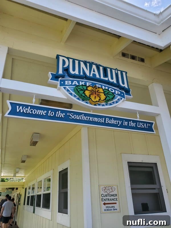 Epic Eats on Hawaii's Big Island: Top Restaurant Picks 3 Punalu'u Bake Shop sign over a vibrant yellow building, indicating a popular Hawaiian bakery