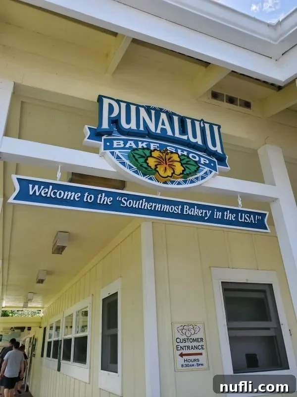 Punalu'u Bake Shop sign over the yellow building 