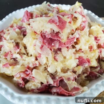 Easy Crock Pot Reuben Dip 6 reuben dip with corned beef in a white bowl