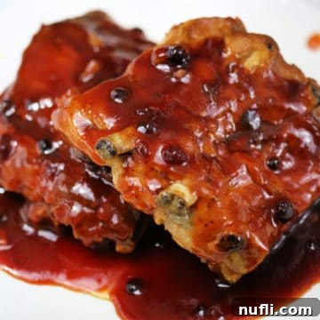 huckleberry BBQ sauce ribs on a white plate
