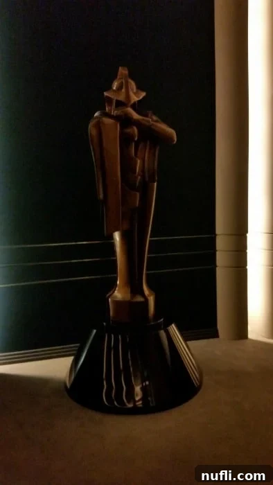 A detailed statue from the Star Wars universe, likely from Palpatine's Office, standing prominently within a refined interior space, indicative of the film legacy present at the ranch.