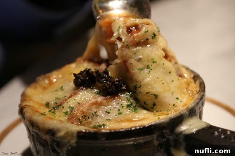 Bardot Brasserie at Aria: An Epicurean Revelation 5 A steaming bowl of traditional onion soup gratin with melted cheese on top.