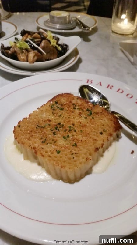 Bardot Brasserie at Aria: An Epicurean Revelation 7 Vertical macaroni and cheese on a Bardot plate, showcasing an artistic and gourmet presentation.