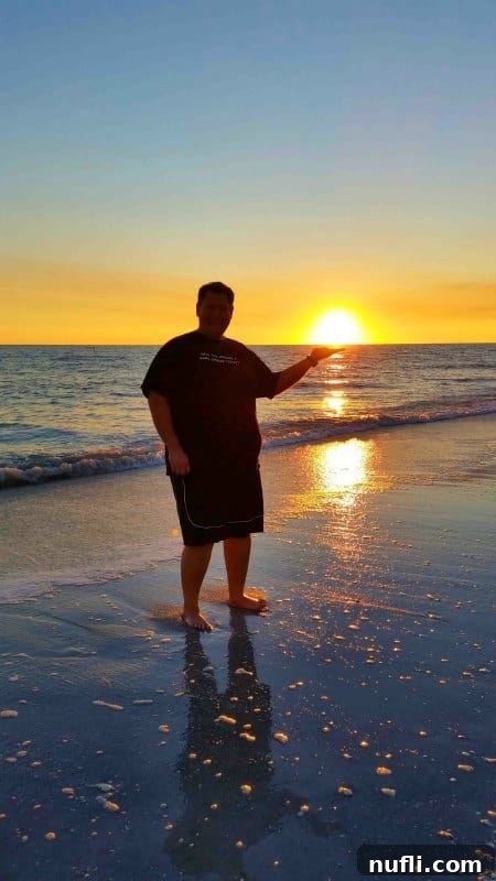Sanibel Island Florida: Your Visual Guide to Paradise 15 A man playfully 'holding' the sun during a beautiful sunset