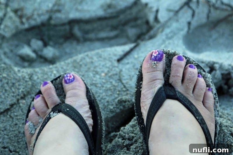 Sanibel Island: Florida's Picture-Perfect Escape 16 Toes in the sand with the ocean gently washing over them