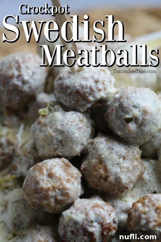 Crockpot Swedish Meatballs served over a bowl of egg noodles, garnished with fresh parsley.