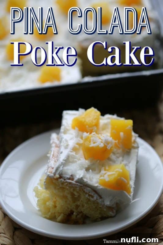 Pina Colada Poke Cake over a slice of cake with pineapples on a small white plate