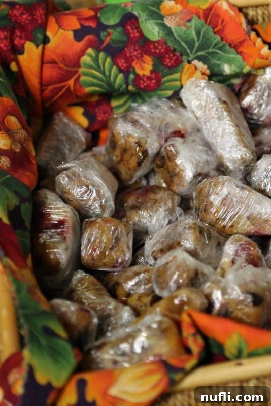 A beautifully arranged basket containing the College of the Ozarks' renowned fruit cake, a testament to student craftsmanship.