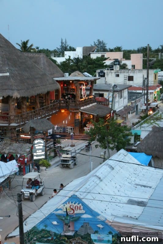 Capturing the Magic of Isla Holbox Mexico 9 Looking over Isla Holbox with golf cars in the road and open air restaurants