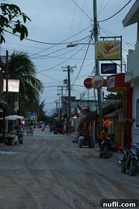 An Idyllic Photo Journey Isla Holbox Mexico 11 Looking down the street at restaurants and bars with bikes and golf carts