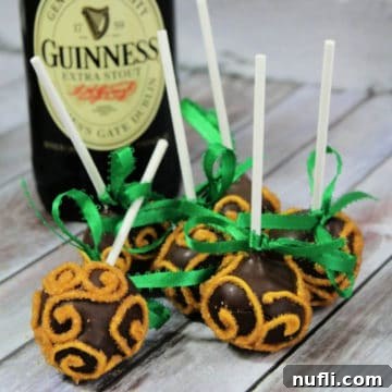 Guinness Cake Pops by a bottle of Guinness