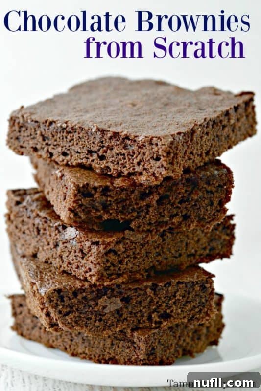 Classic Brownies from Scratch text over a white plate with brownies stacked on it. 