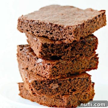 Classic Chocolate Brownies stacked on a white plate