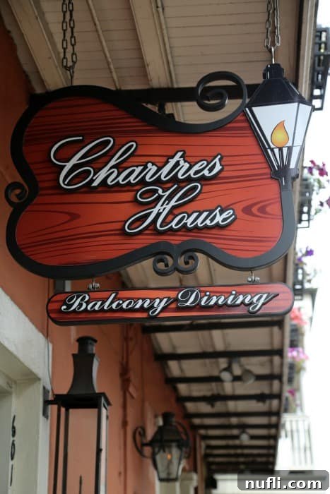 The charming exterior sign of Chartres House Restaurant in the French Quarter.