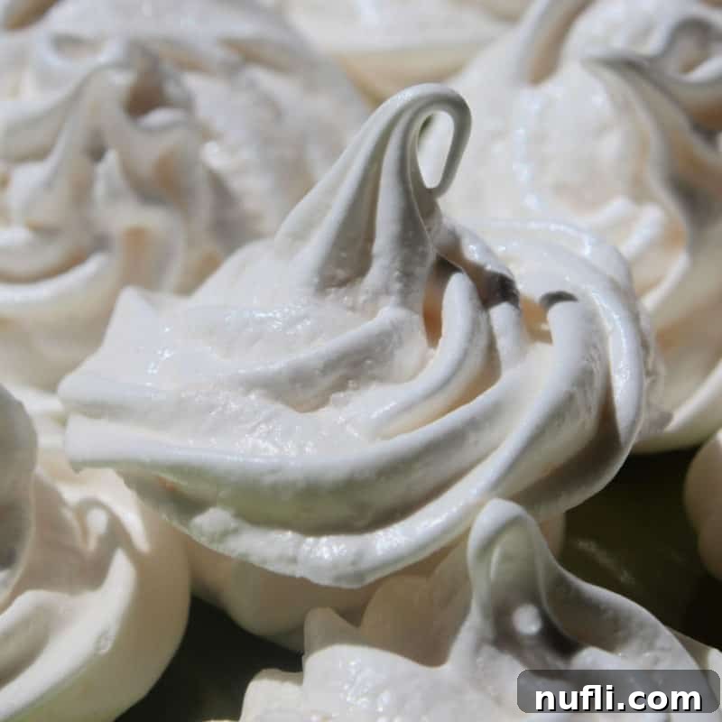 Lemon Meringue Cookies piled high on a white plate
