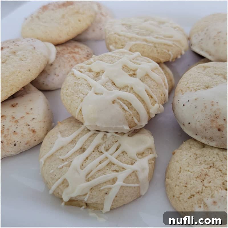 Eggnog cake mix cookies with icing on a white plate