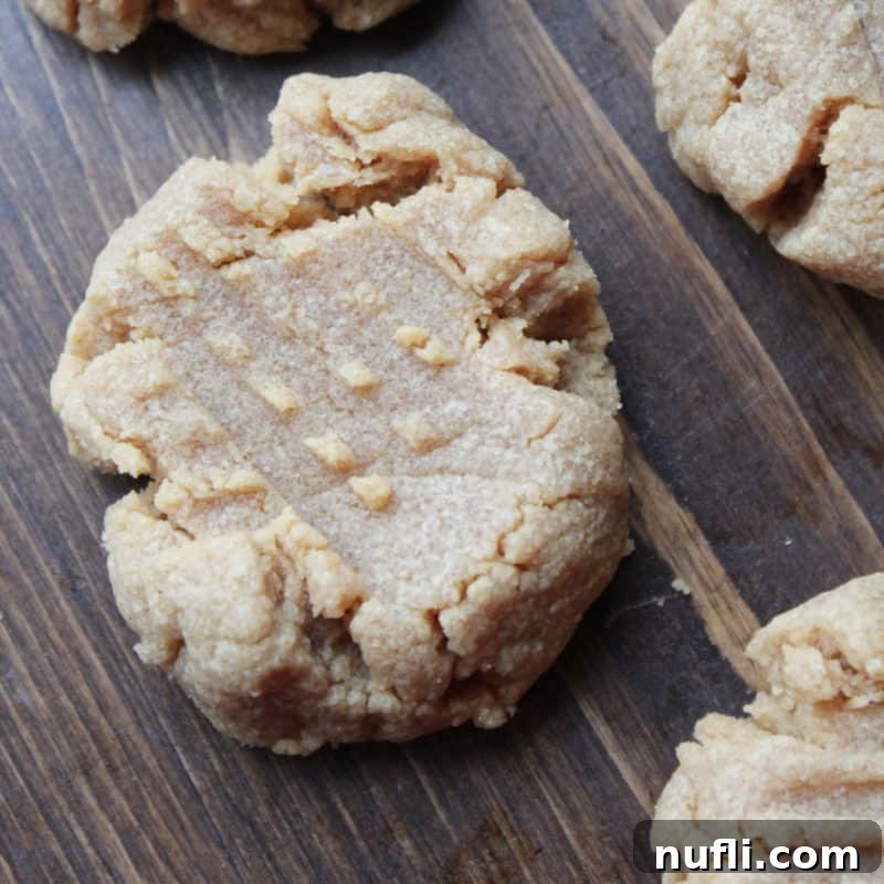 Simple 3 Ingredient Peanut Butter Cookies on a wooden board