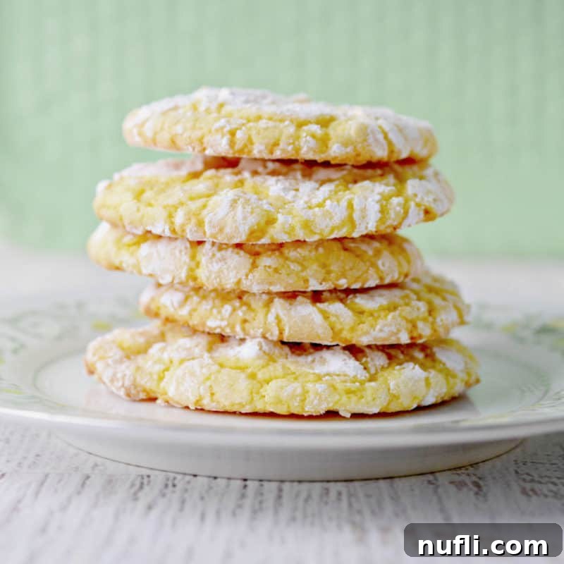 Stack of lemon cake mix cookies on a white plate