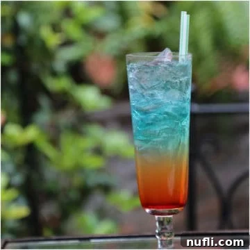 Rainbow cocktail in a tall glass