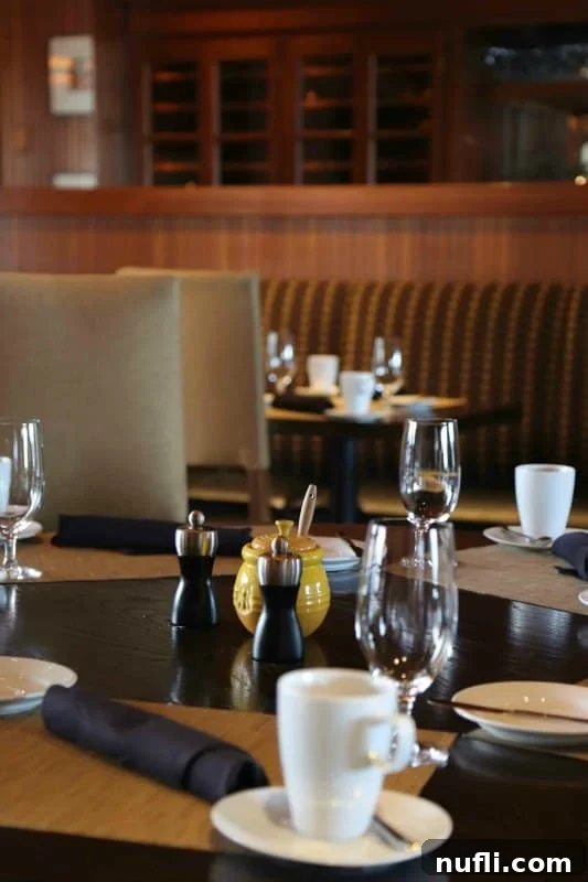 table with honey pot and place settings