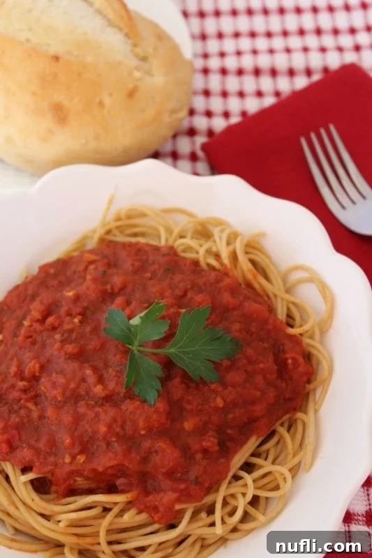Copycat Olive Garden Marinara Sauce - Rich, homemade tomato sauce in a pot