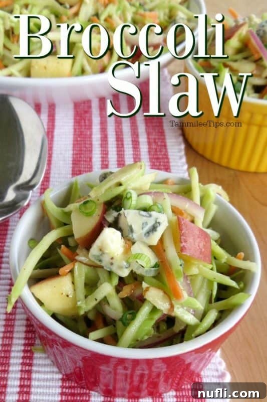 Broccoli slaw in a red ramekin bowl next to a white bowl and spoon