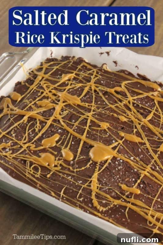 Salted caramel rice krispie treats over a pan of chocolate and caramel covered treats
