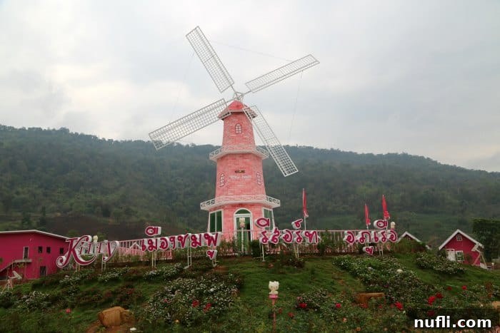 Pink windmill and various Hello Kitty figurines adorning the resort grounds