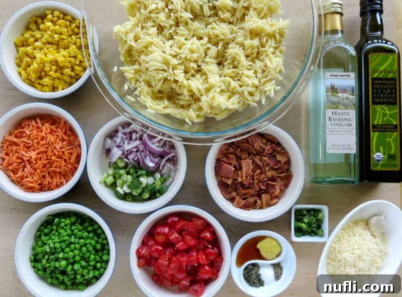 corn, carrots, peas, orzo, bacon, white balsamic vinegar, cheese, and spices in small white bowls 