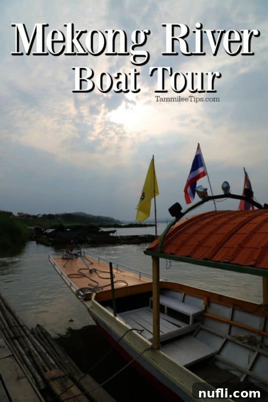 Mighty Mekong Voyage: Thailand to Laos 2 Captivating boat tour on the Mekong River, a longtail boat with flags symbolizing the cross-border journey between Thailand and Laos, under a clear sky.