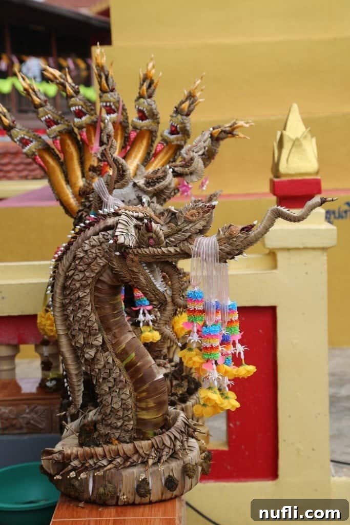 Colorful offerings, including flowers and incense, placed at a temple in Chiang Khan.