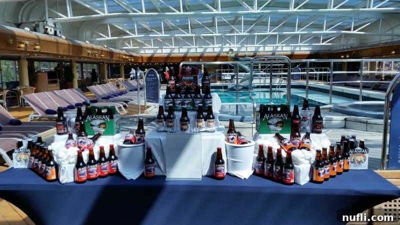 A vibrant display of various Alaskan craft beers from Alaska Brewing Company, showcased on a table, highlighting local partnerships on Holland America cruises.