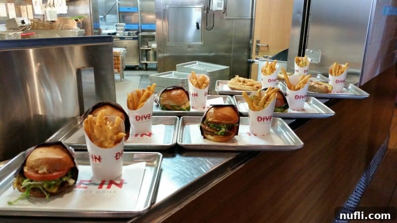 Mouth-watering gourmet burgers and crispy fries served fresh on elegant silver trays