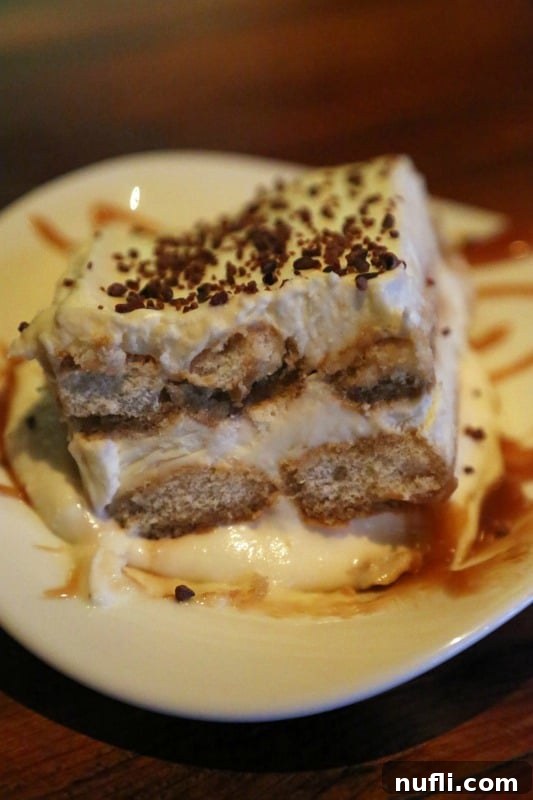 Delicious beer tiramisu served on a white plate