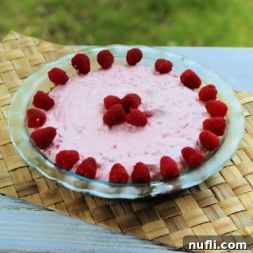 Raspberry No Bake Pie in a glass pie dish
