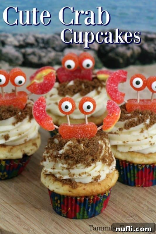 Super cute Crab Cupcakes arranged on a plate, featuring cupcakes topped with vibrant, candy-made crabs on a 'sandy' frosting base, perfect for ocean-themed celebrations.