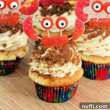 Crab Cupcakes with charming Hawaiian flower paper liners, beautifully arranged for an ocean-themed dessert table.